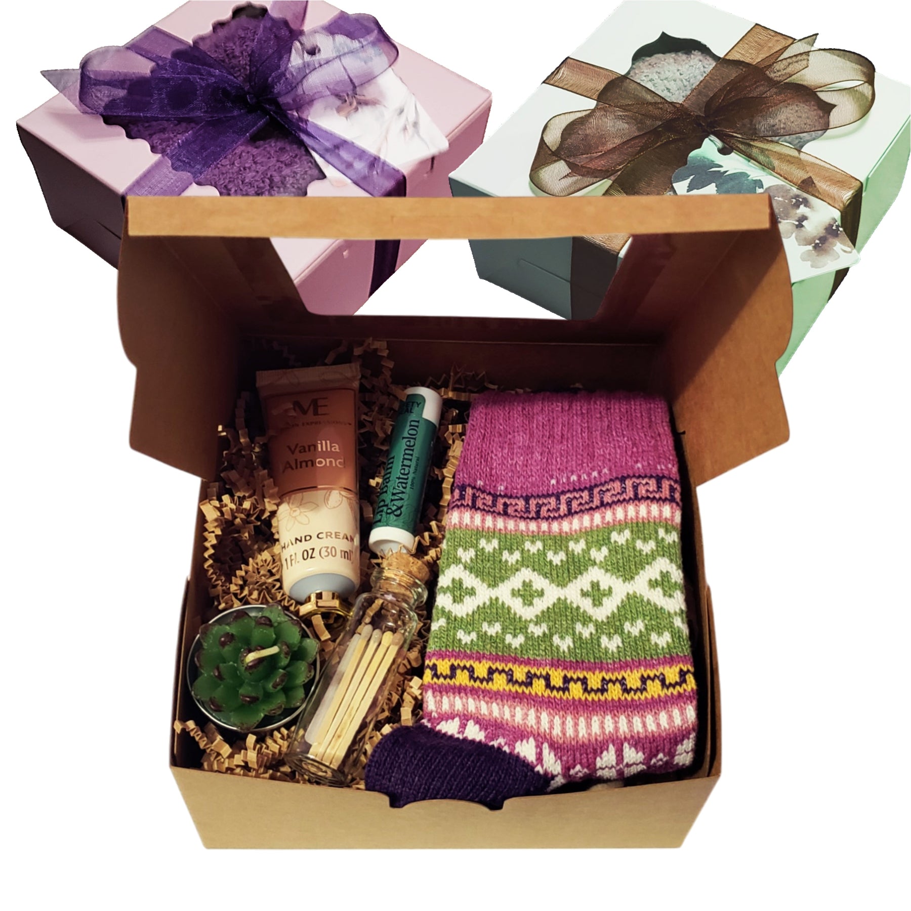Each box includes 1 pair of wool socks, a mini succulent candle, nourishing lip balm, travel-size hand lotion, and matches in a glass jar with a cork stopper — all wrapped with a ribbon bow and gift tag, ready to gift.  Ideal for women of all ages, this versatile box makes a lovely present for friends, coworkers, moms.